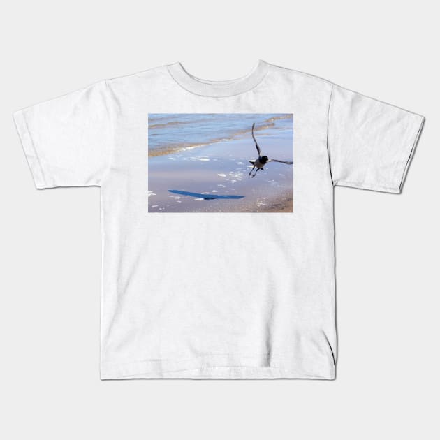 Grey crow, flying off above the water Kids T-Shirt by lena-maximova